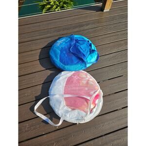 2 Swimways Folding Floats. Blue and a white and pink Hawaiian theme.